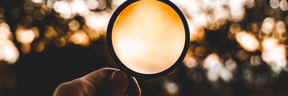 A magnifying glass. Searching for customers and understanding your product is critical.