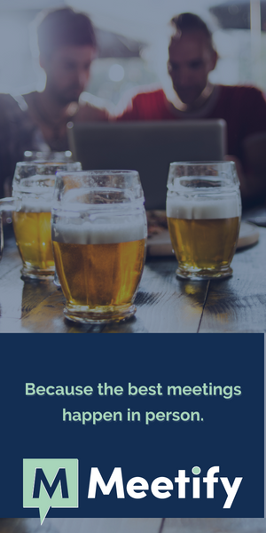 Two people grab drinks and meet up. The best meetings happen in person and are scheduled with Meetify.