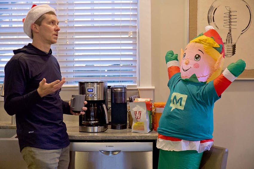 Meetify staff chat around the coffee machine.