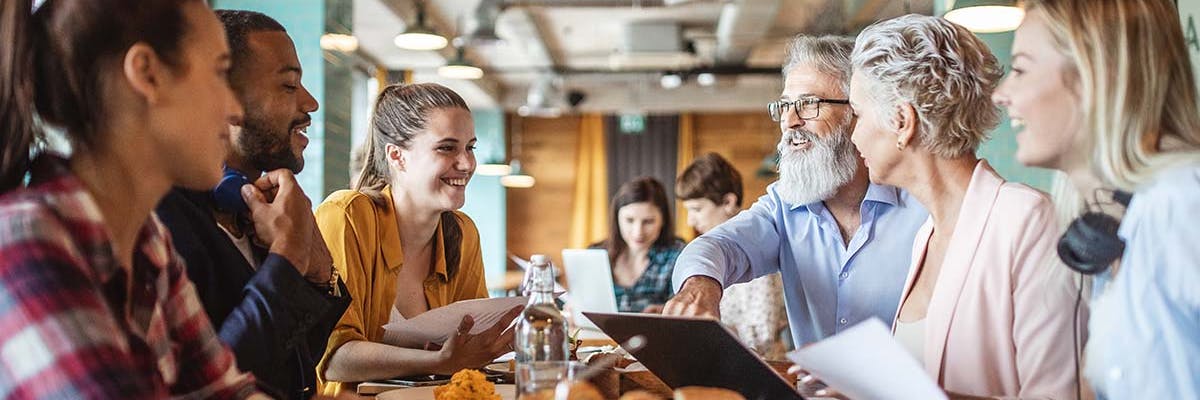 A diverse group having a face to face meeting