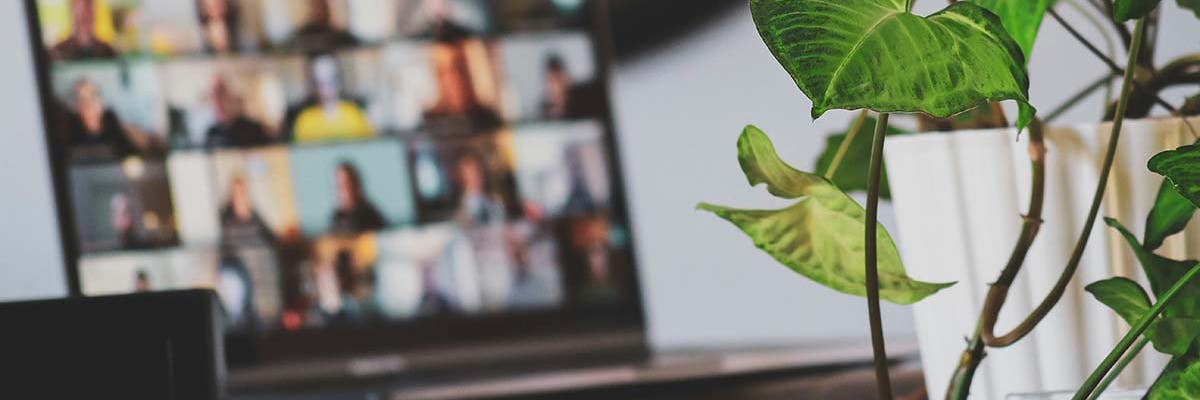 A laptop screen with a never-ending amount of people in a virtual meeting. Unsplash photo by Photo by rivage