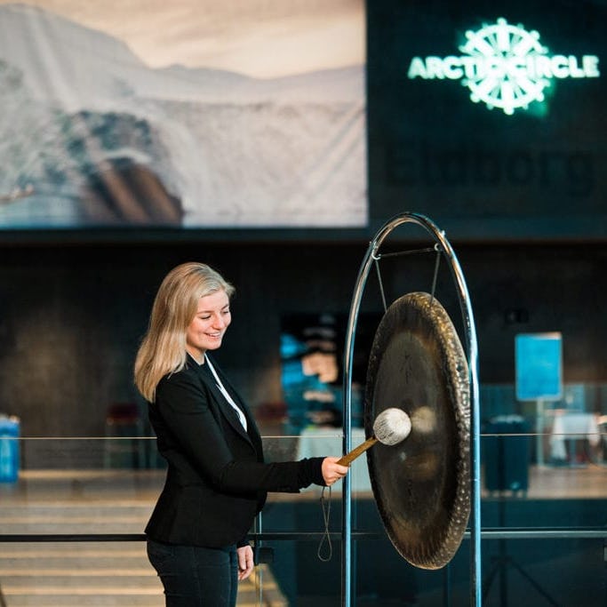 woman hitting a Gong