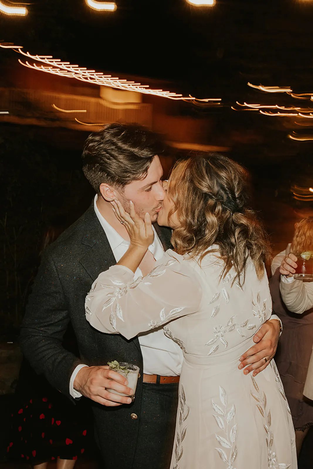 Sacred Mountain Julian wedding couple share a kiss on their dancefloor