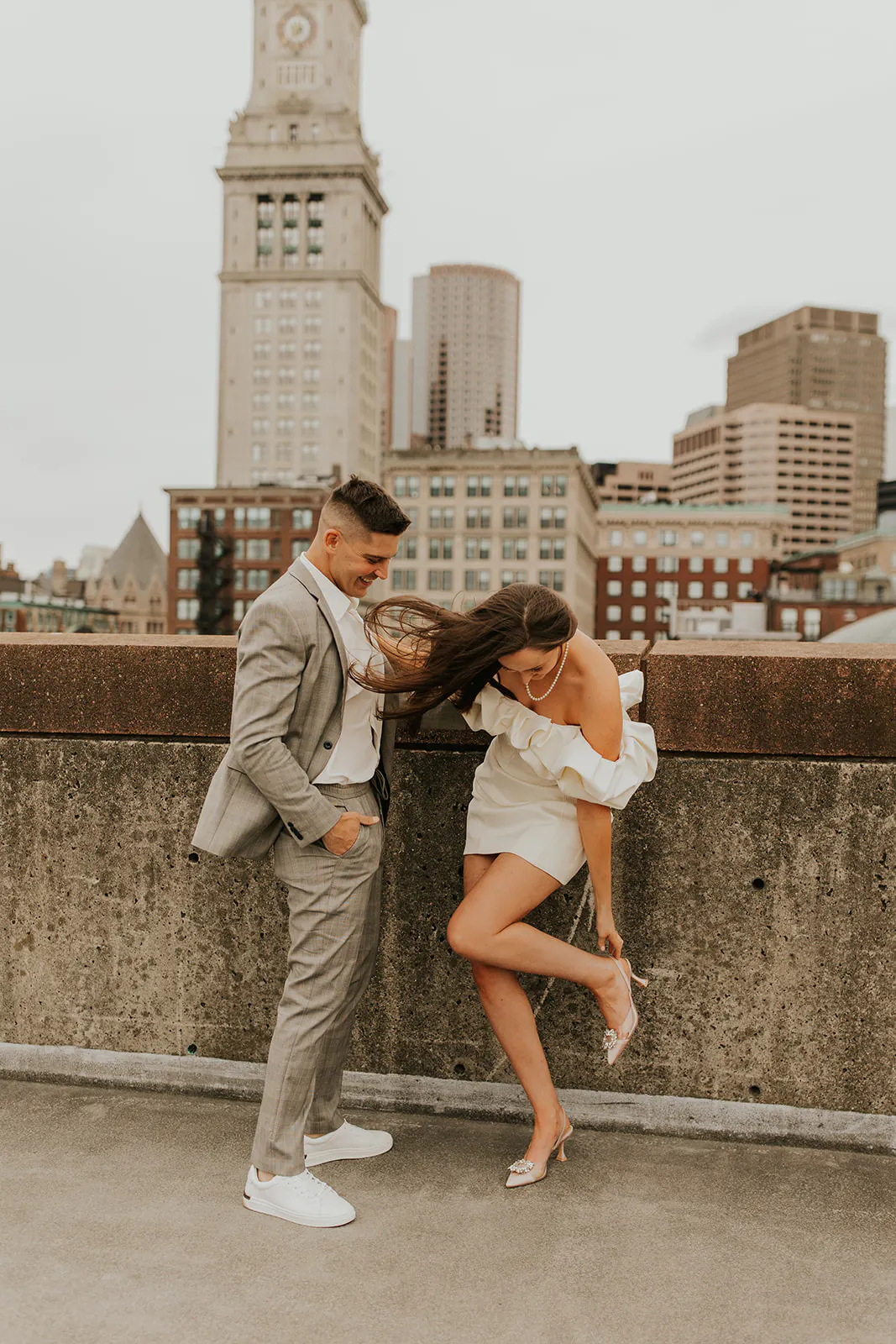 Boston lovers pose on a rooftop on the North End 