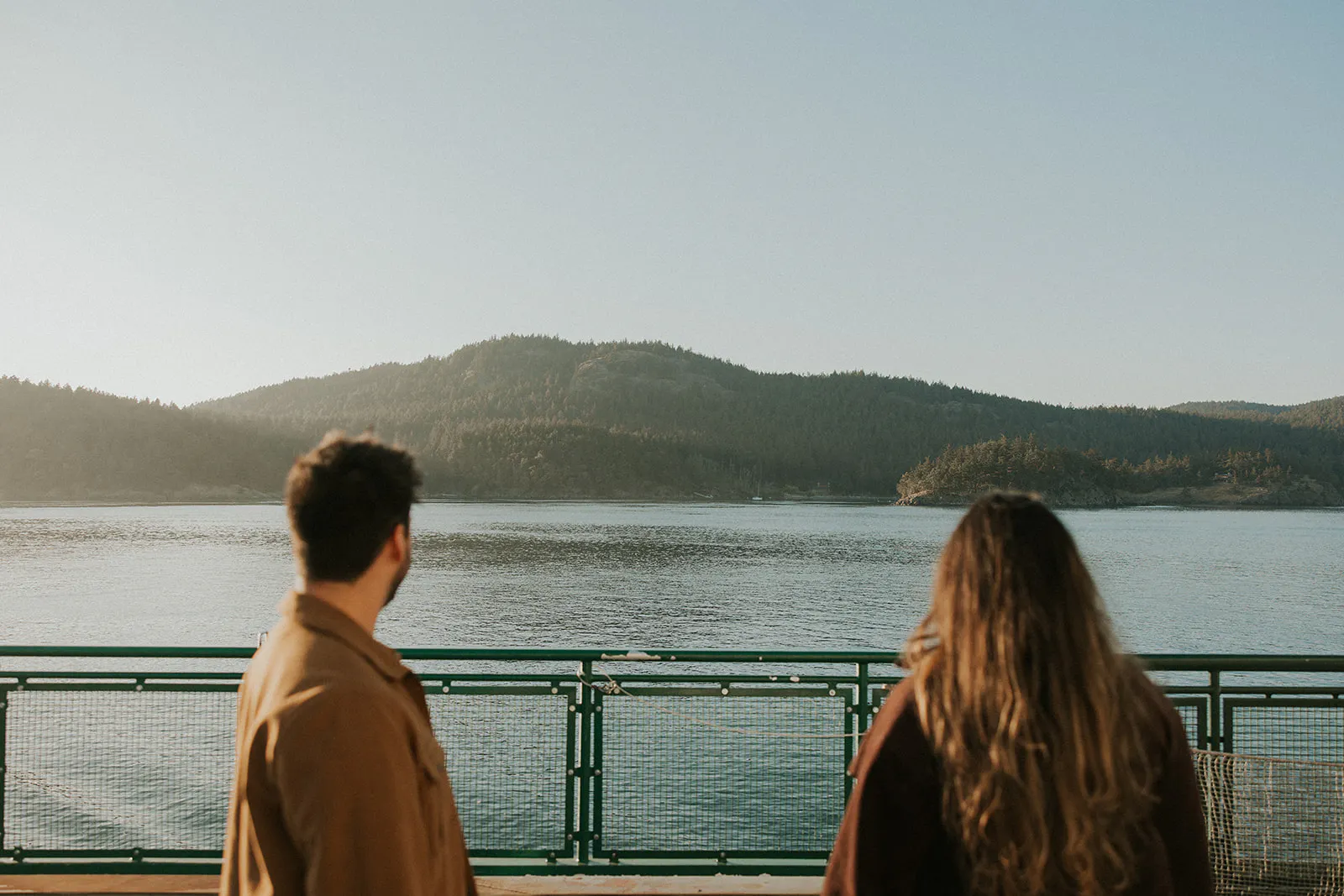 couple standing together on the ferry to san juan island
