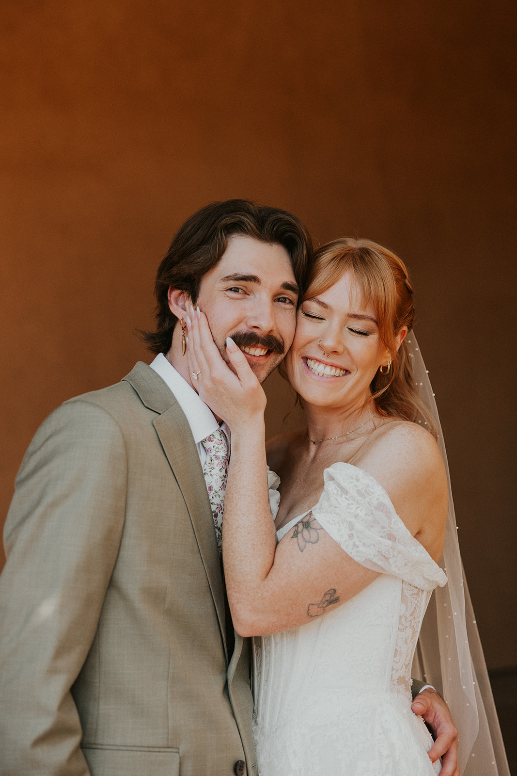 Bride and Groom giggling together after getting married in San Diego, Ca