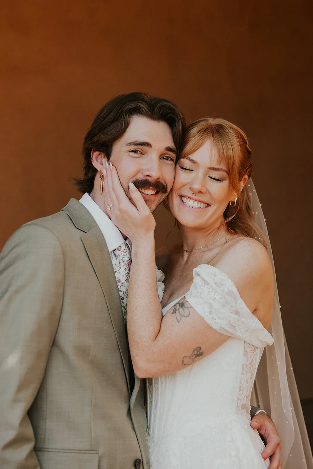 Bride and Groom giggling together after getting married in San Diego, Ca