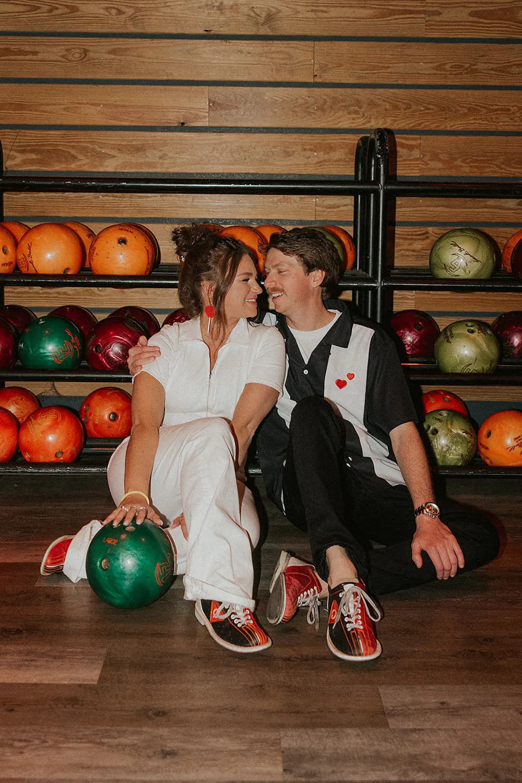 Couple at their Bowling Alley Rehearsal Dinner