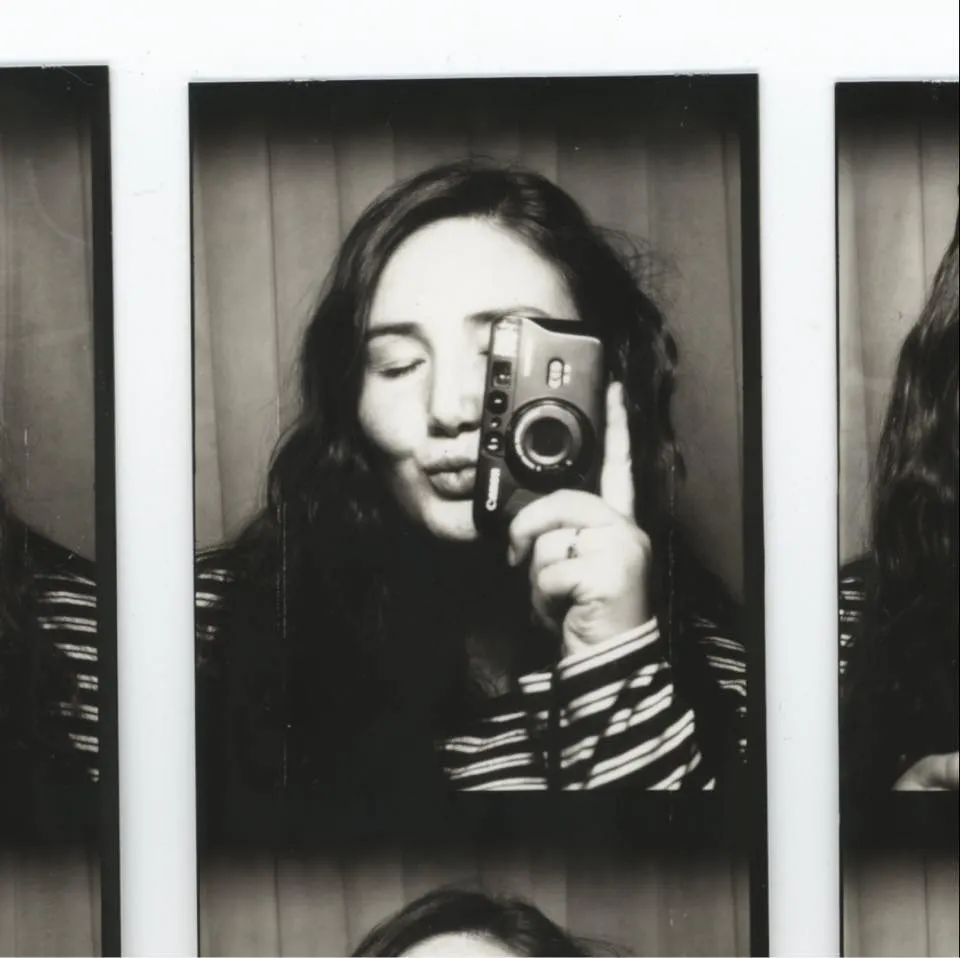 San Diego Based Wedding Photographer posing in Vintage Photo Booth in Costa Mesa