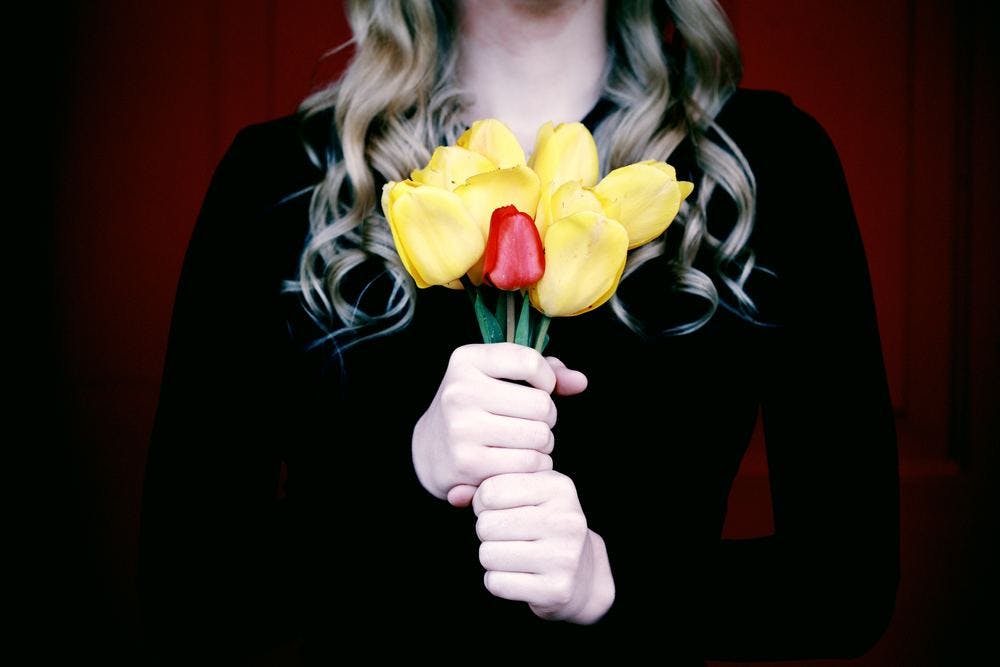 woman-flowers-yellow