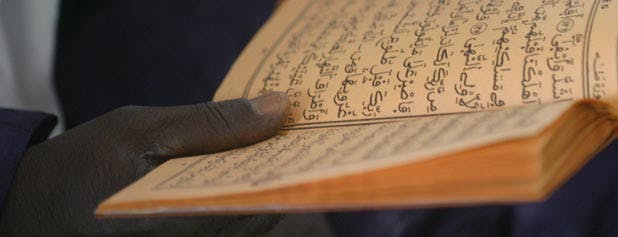 main tenant le Coran