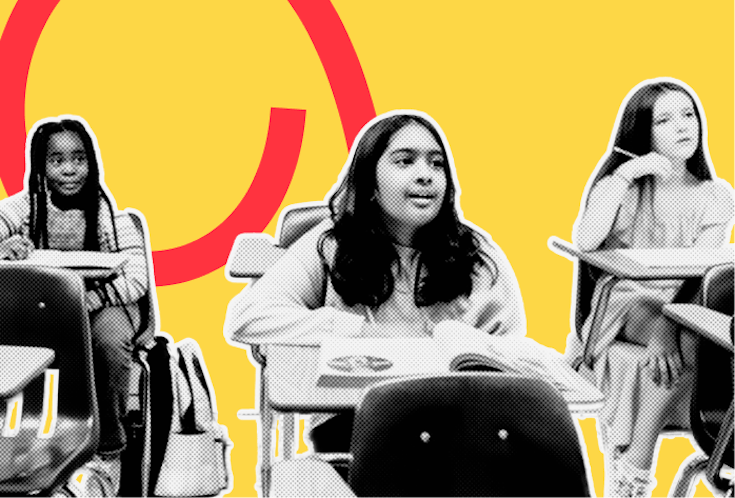 Kinder sitzen an ihren Tischen im Klassenzimmer