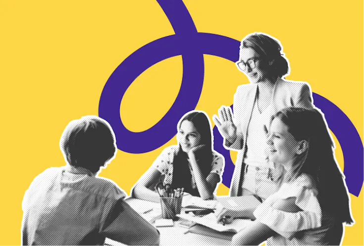 Schülerinnen und Schüler führen an einem Tisch eine lebhafte Diskussion mit ihrer Lehrkraft.