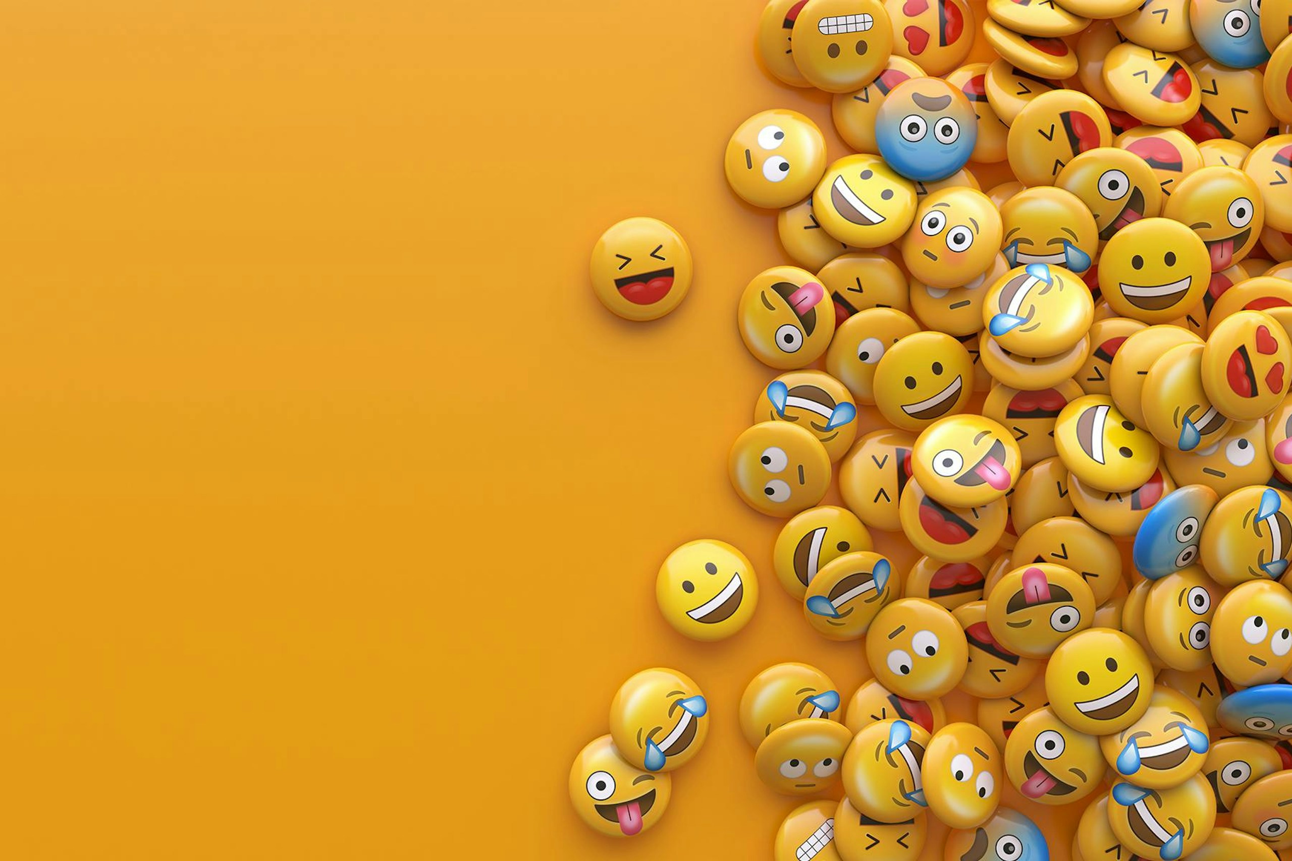 A pile of emojis on a plain yellow background.