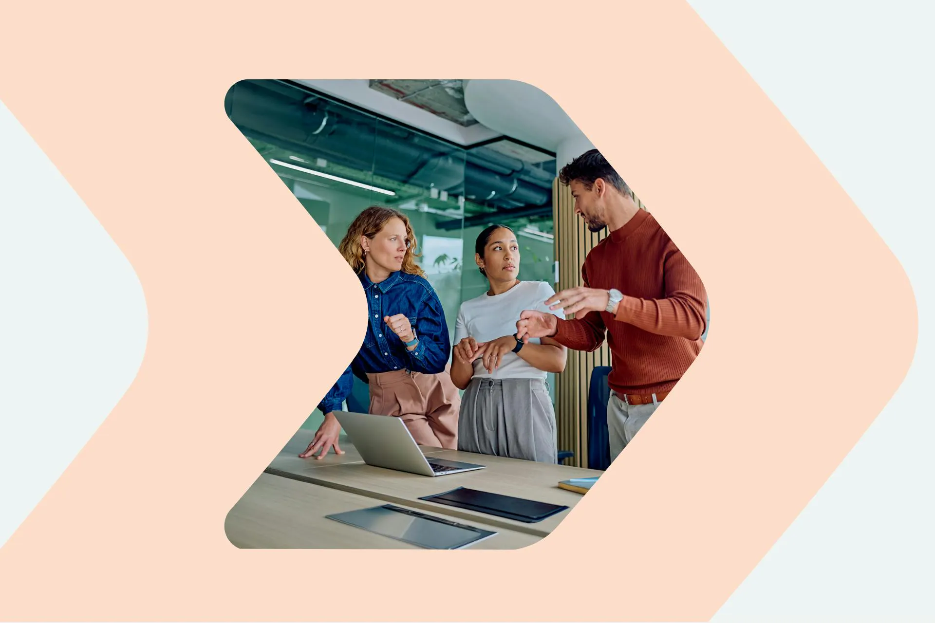 An image of people engaged in discussion in an office