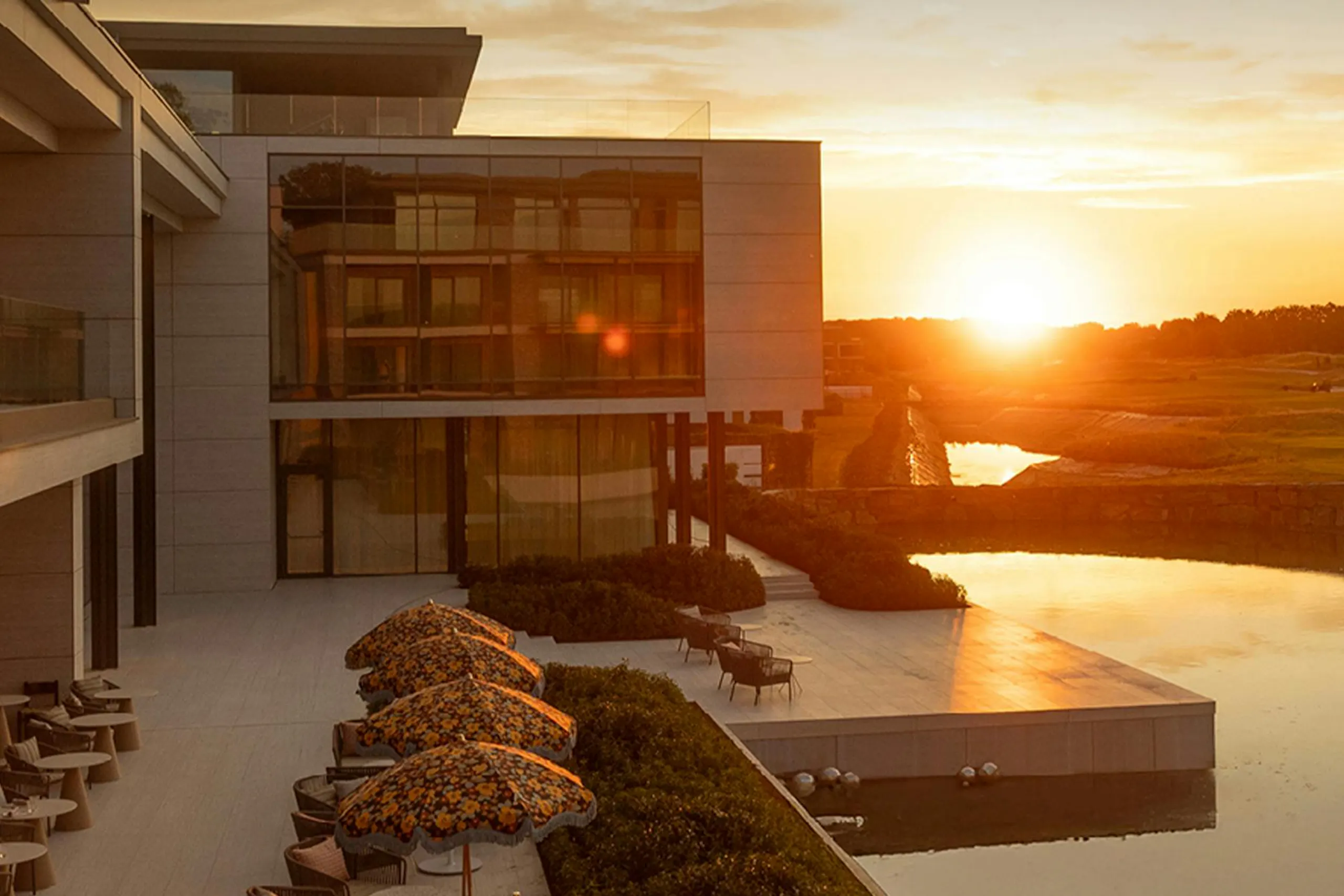 An photo of a sunset beyond a luxury Radisson Hotel Group property with an infinity pool for Meltwater case study