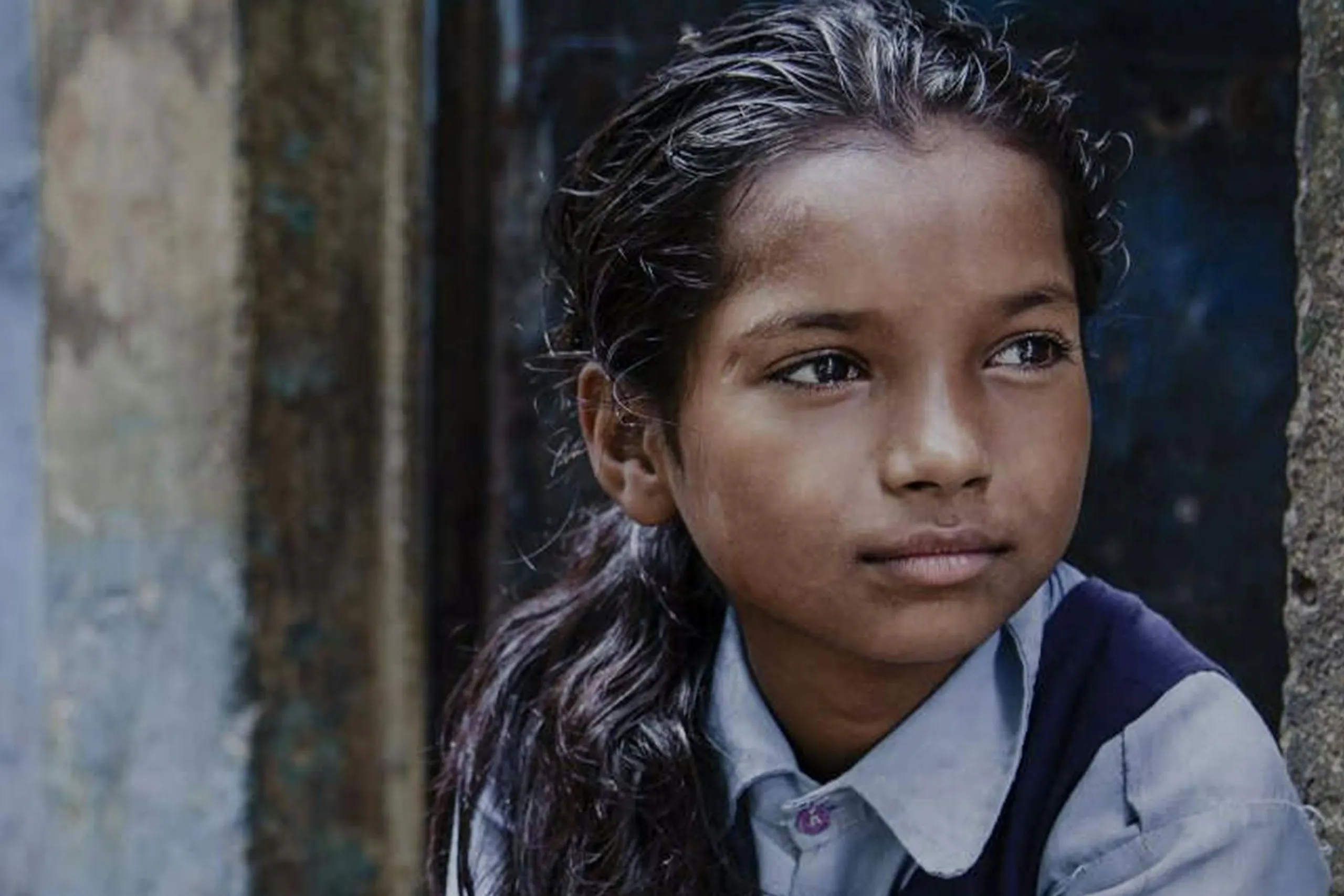 An image of a young girl looking into the distance 