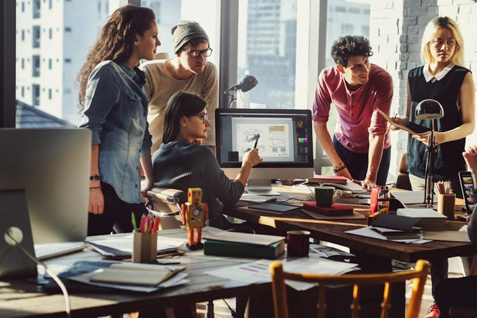 Photo of a team working together in an office