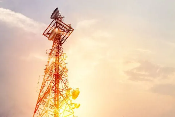 telecom tower with an orange sky