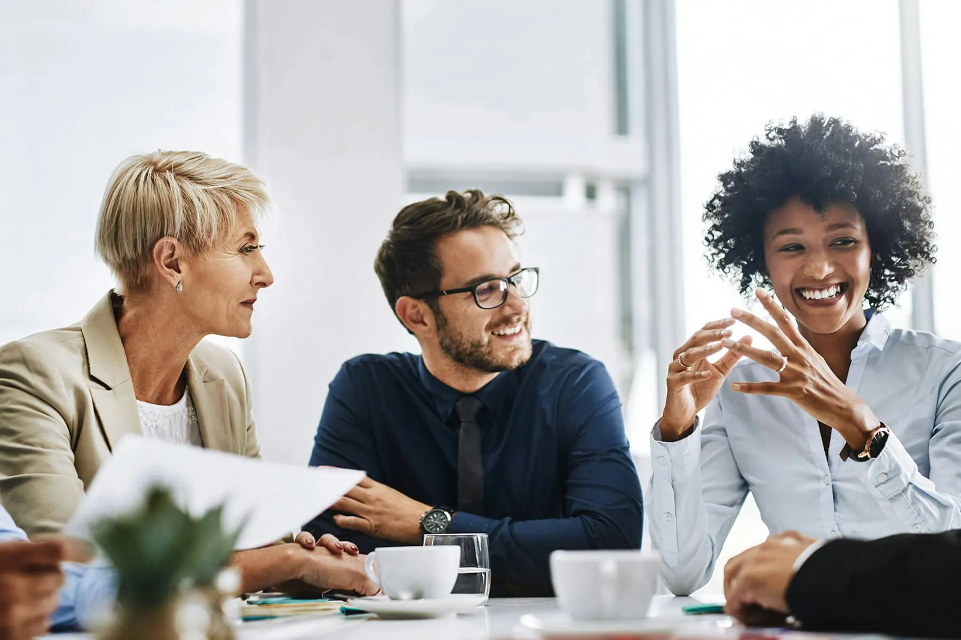 A group of professionals gathered in a conference room for the Definitive Guide to Social Listening
