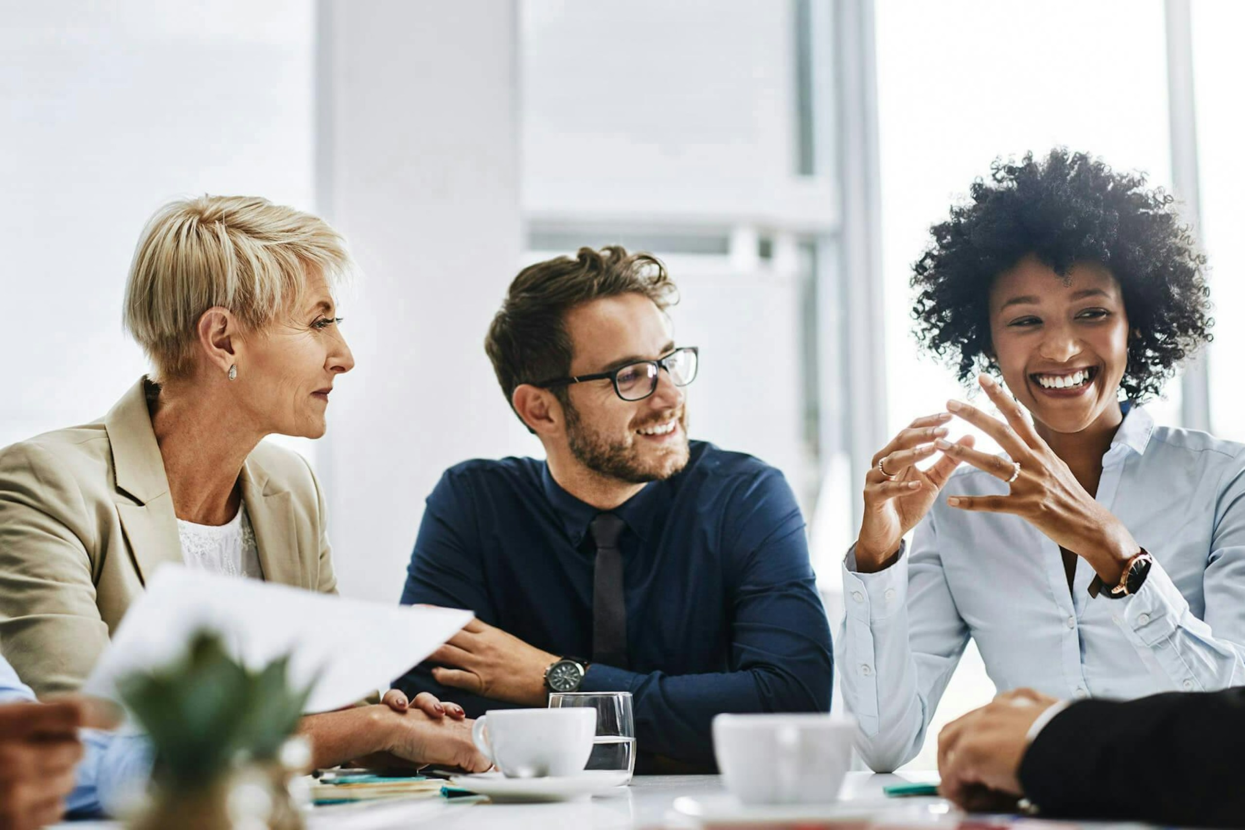 A group of professionals gathered in a conference room for the Definitive Guide to Social Listening