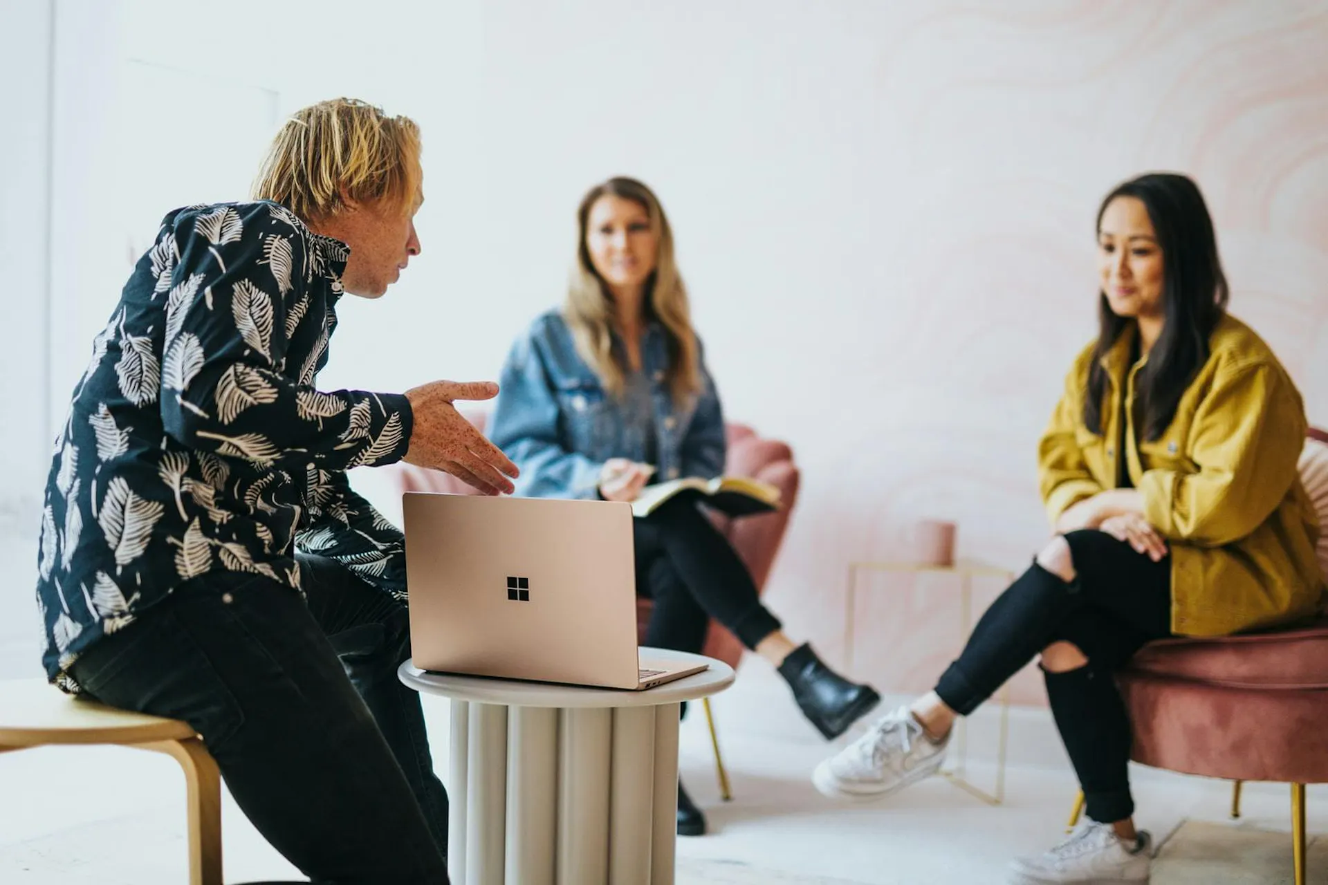 group looking at laptop screen