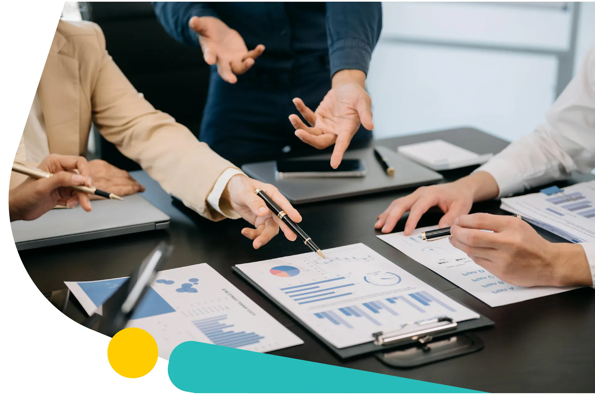 A group of three people in a meeting looking at several different graphs. Social Listening for Benchmarking Guide