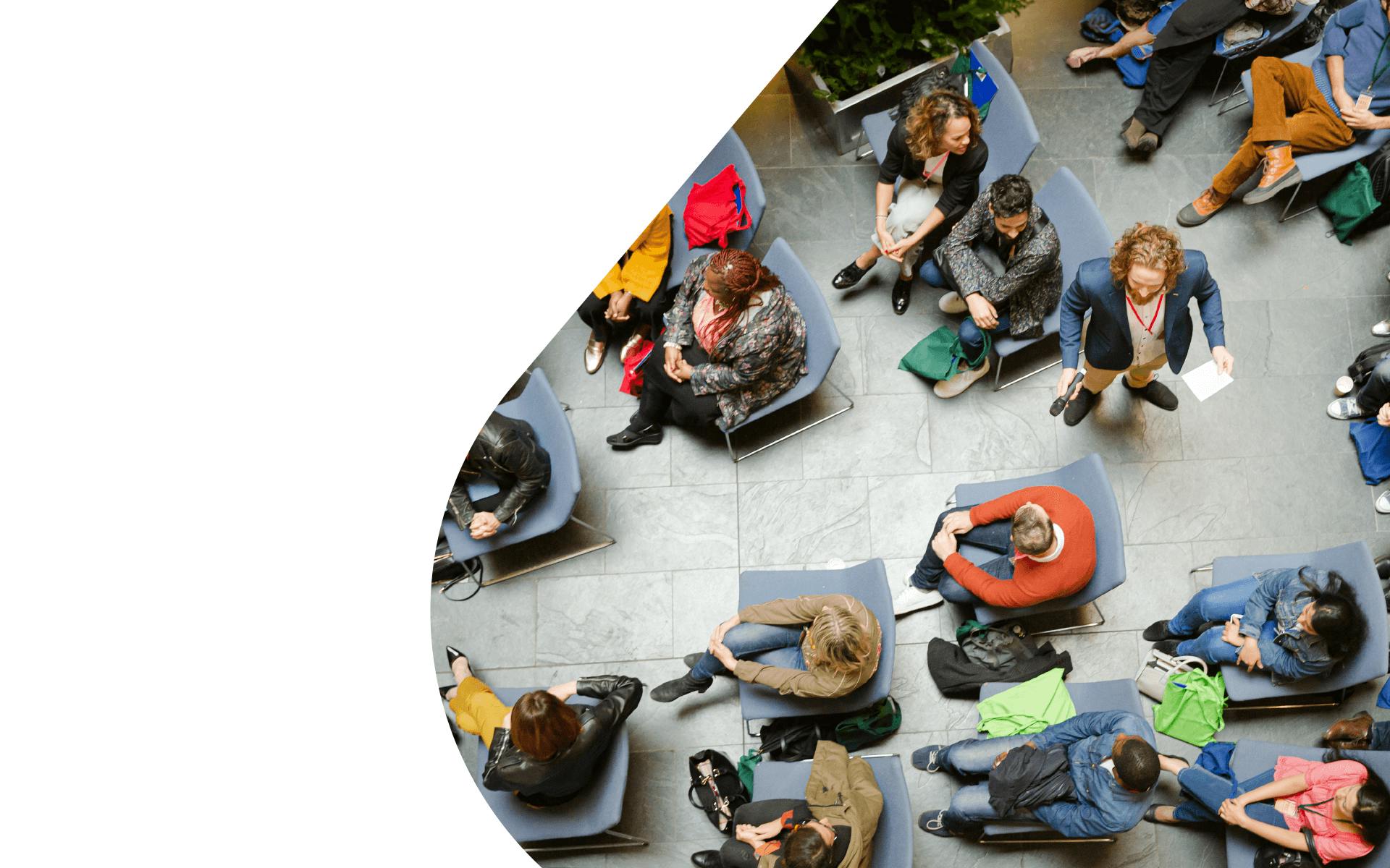 Image of a speaker addressing a seated crowd, for the Data-Driven PR Playbook.