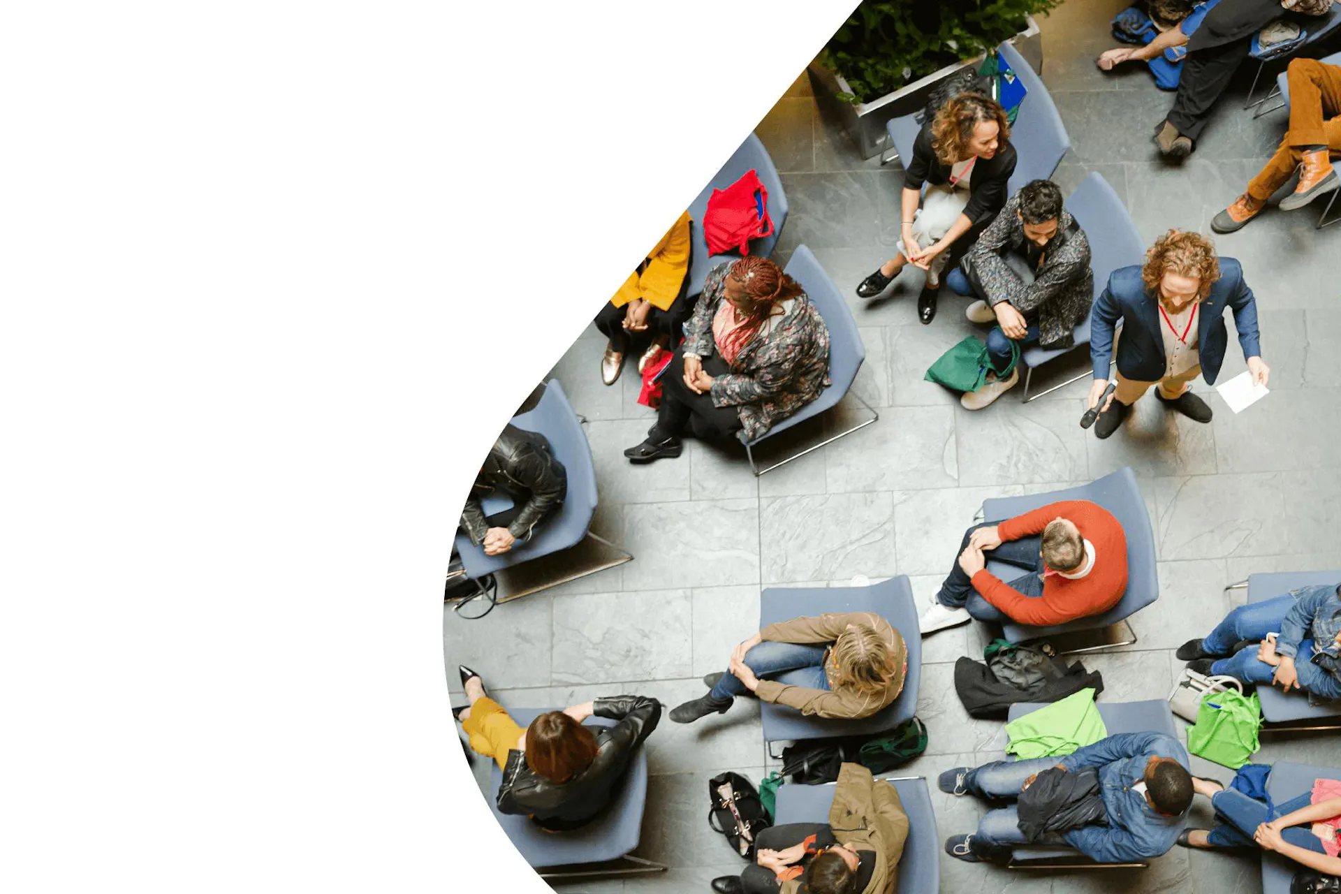 Image of a speaker addressing a seated crowd, for the Data-Driven PR Playbook.