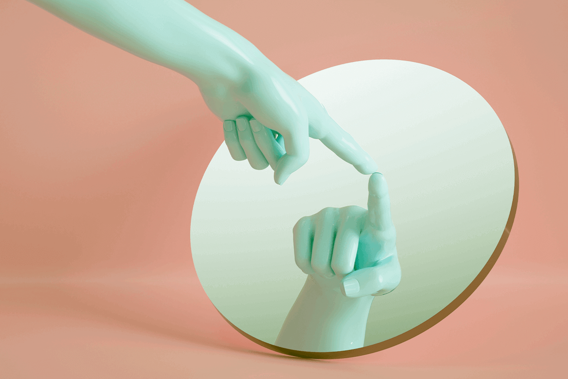 green hand pointing to a round mirror