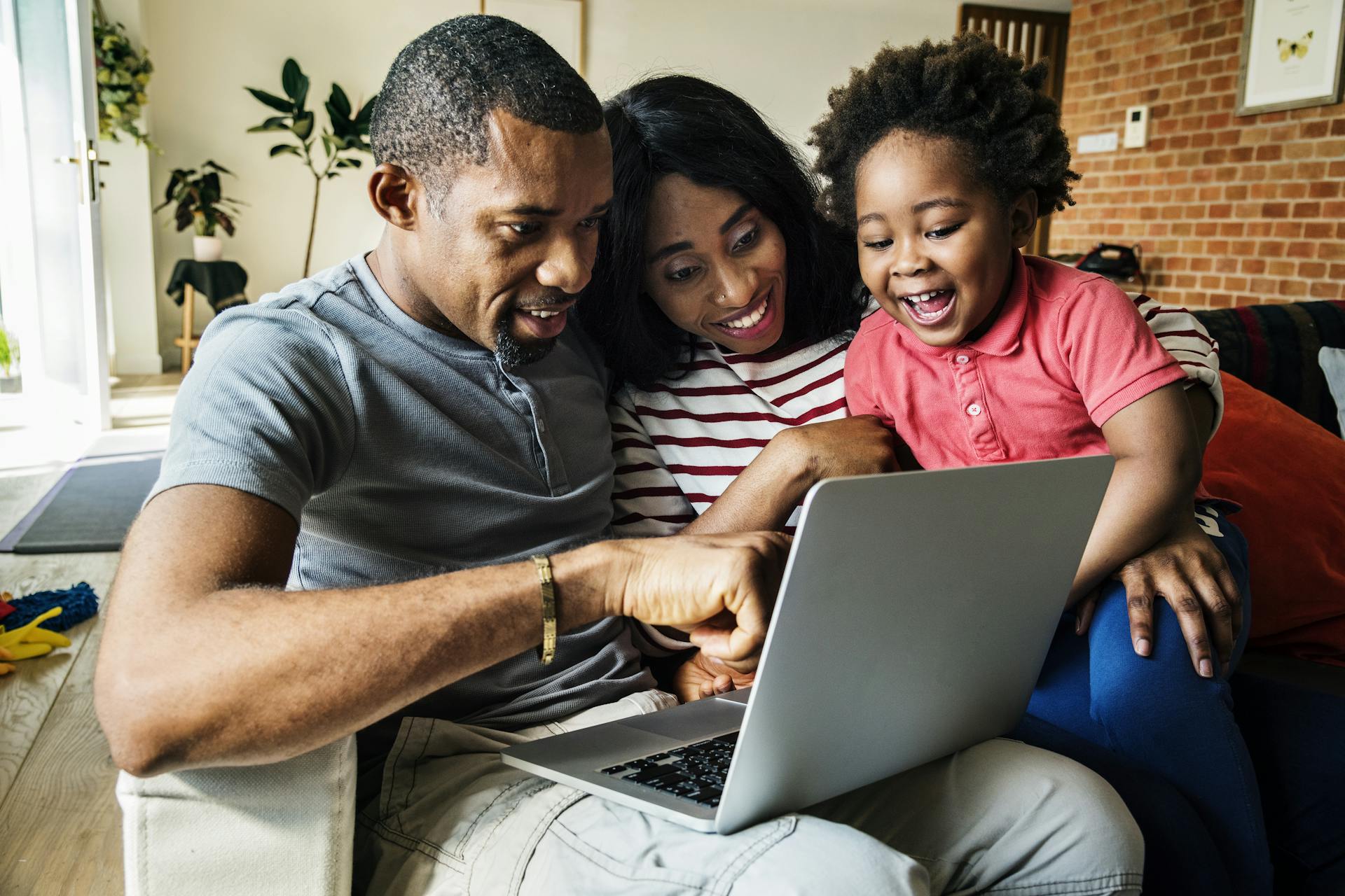 Family looking at laptop together