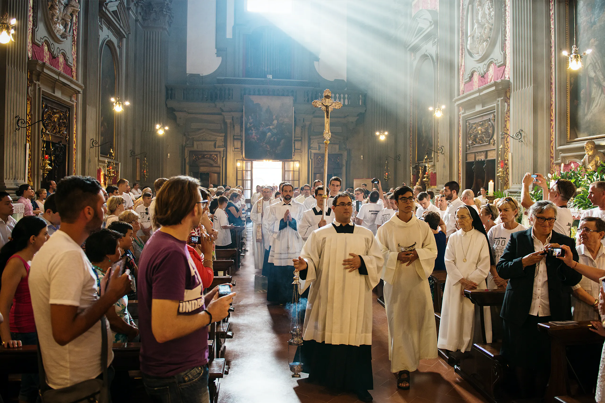 Photo of a Catholic church with people inside