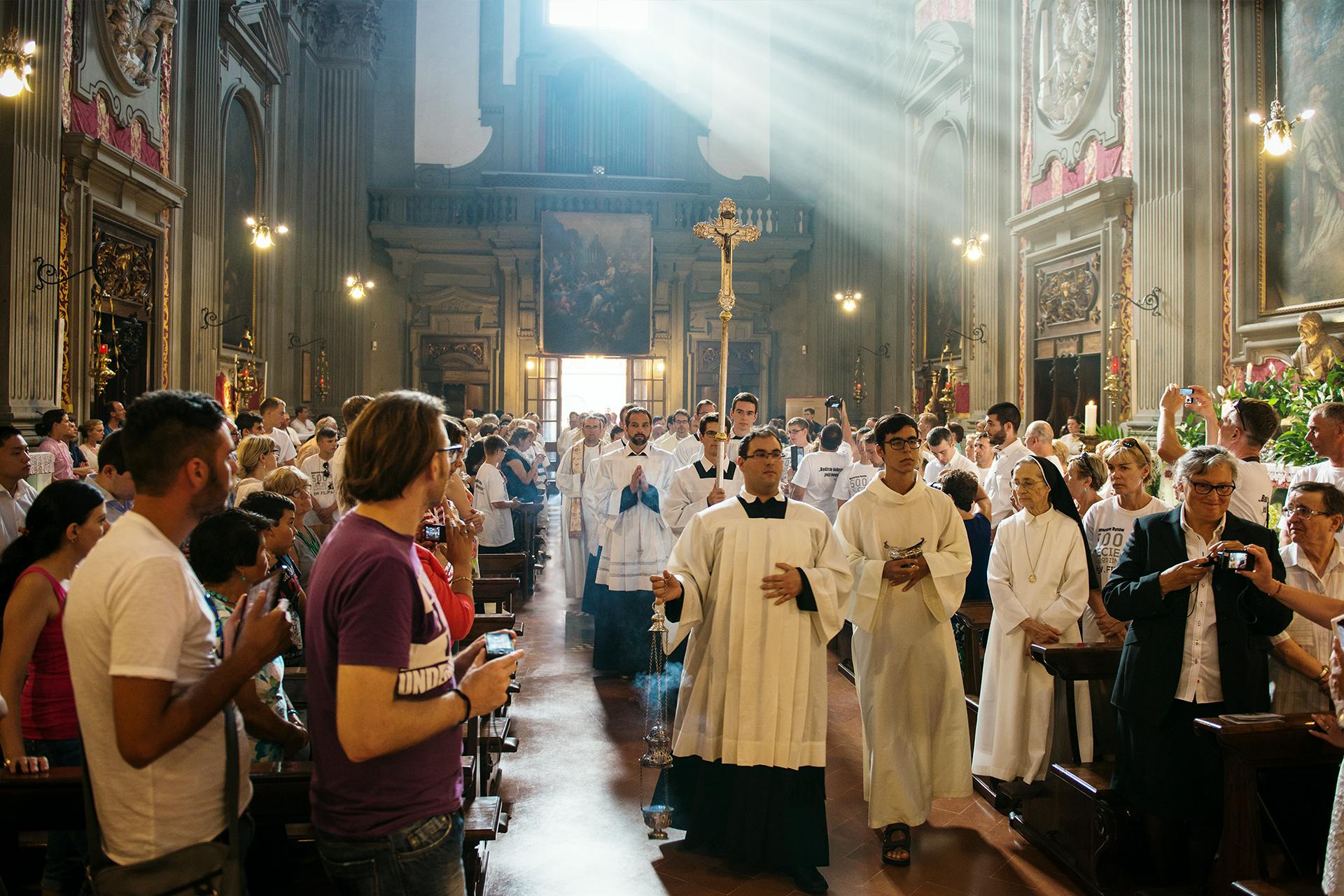 Photo of a Catholic church with people inside