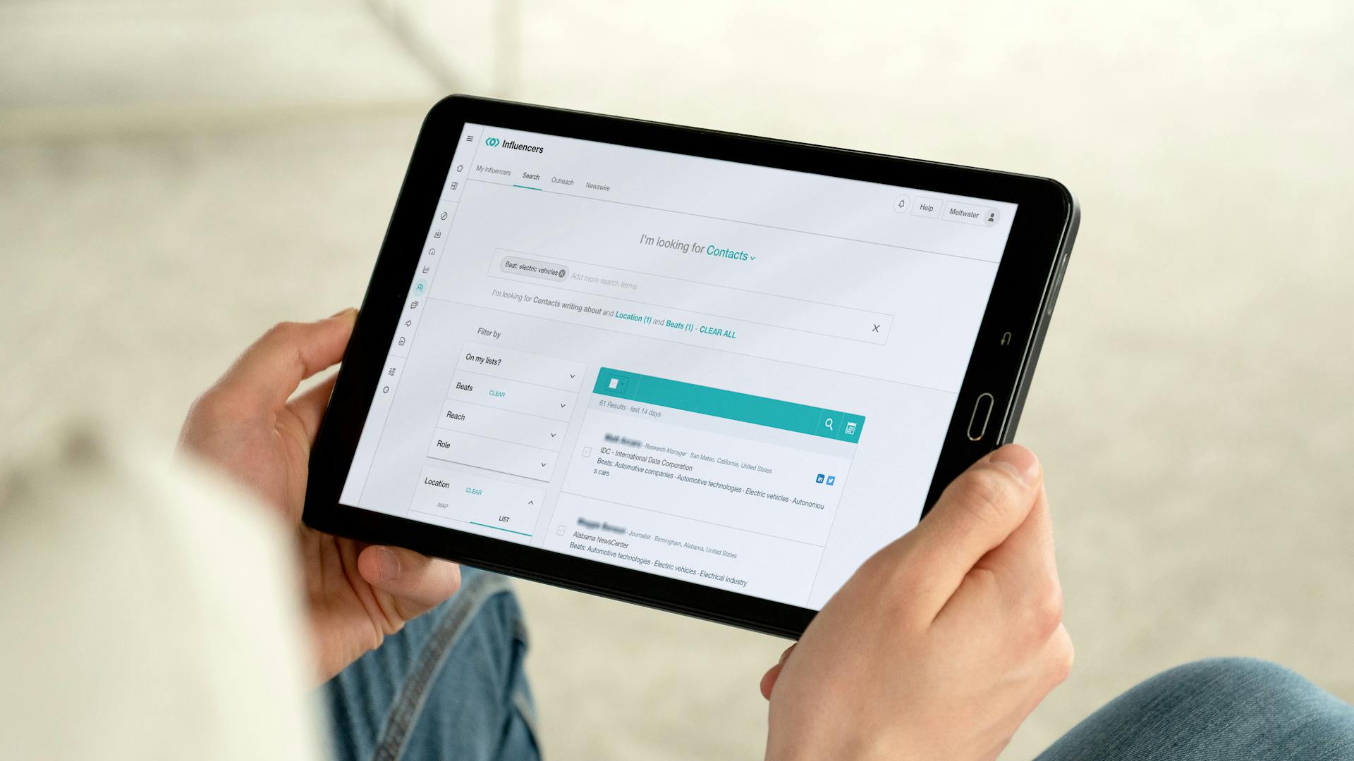 a person holding a tablet