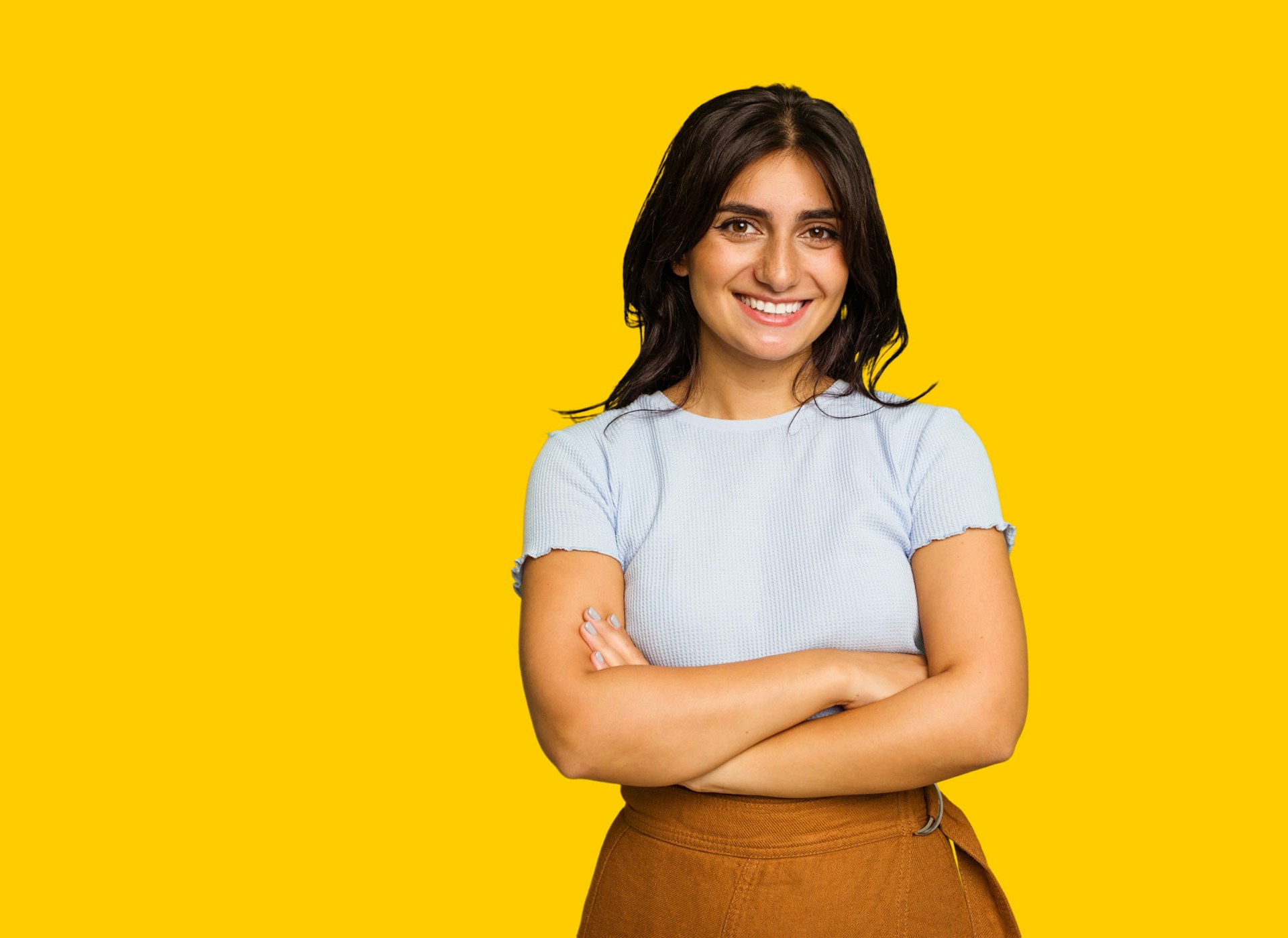 Woman standing in front of a yellow background
