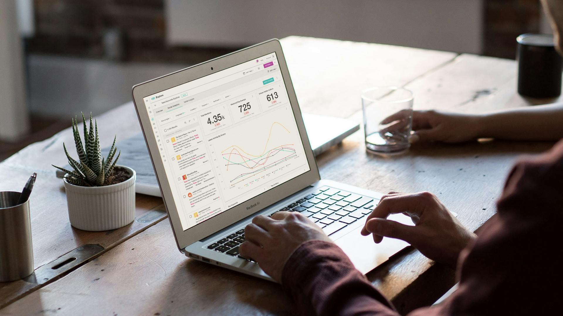 person working with media monitoring on laptop