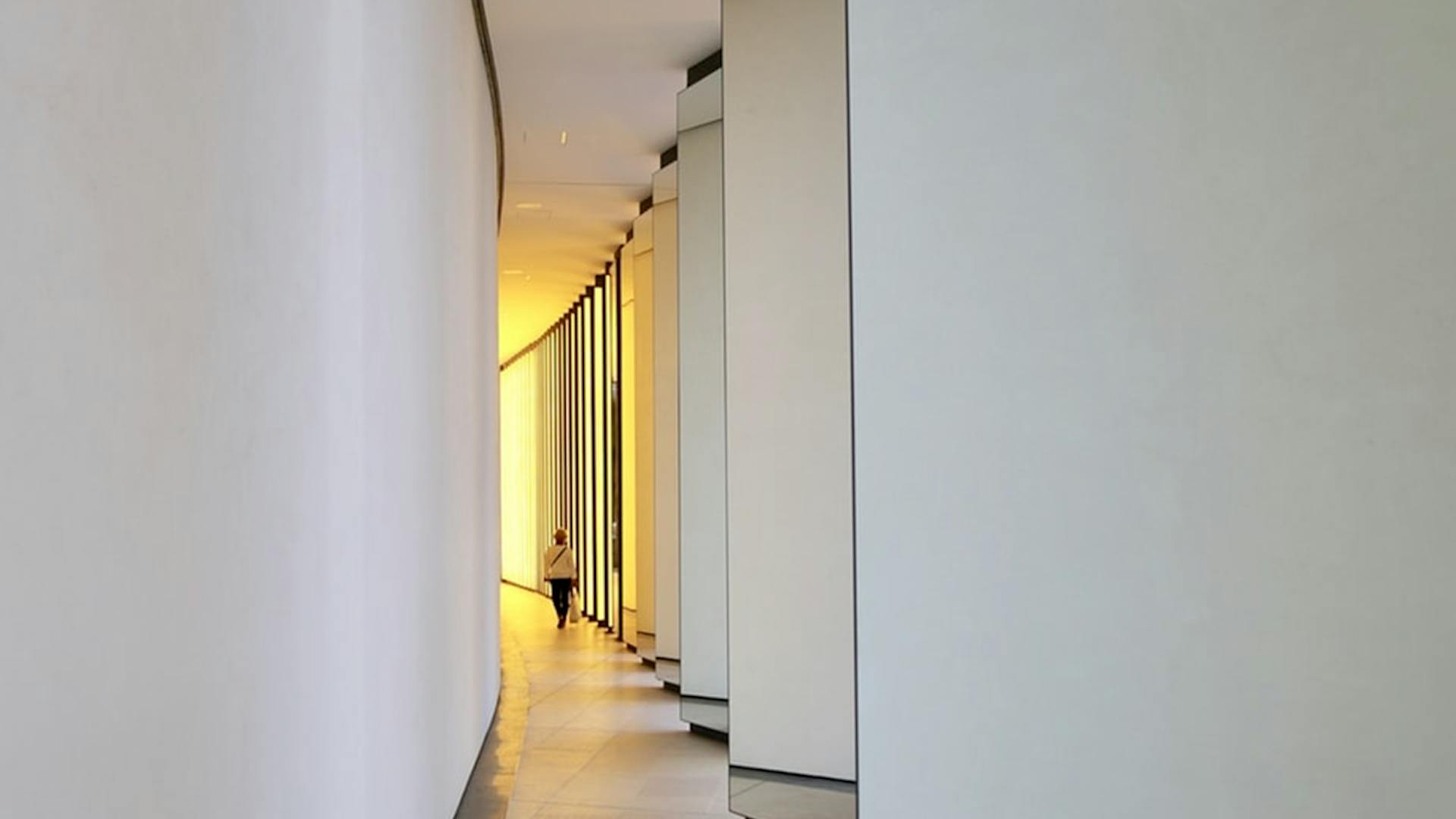 Photo of a bright hallway with yellow lights