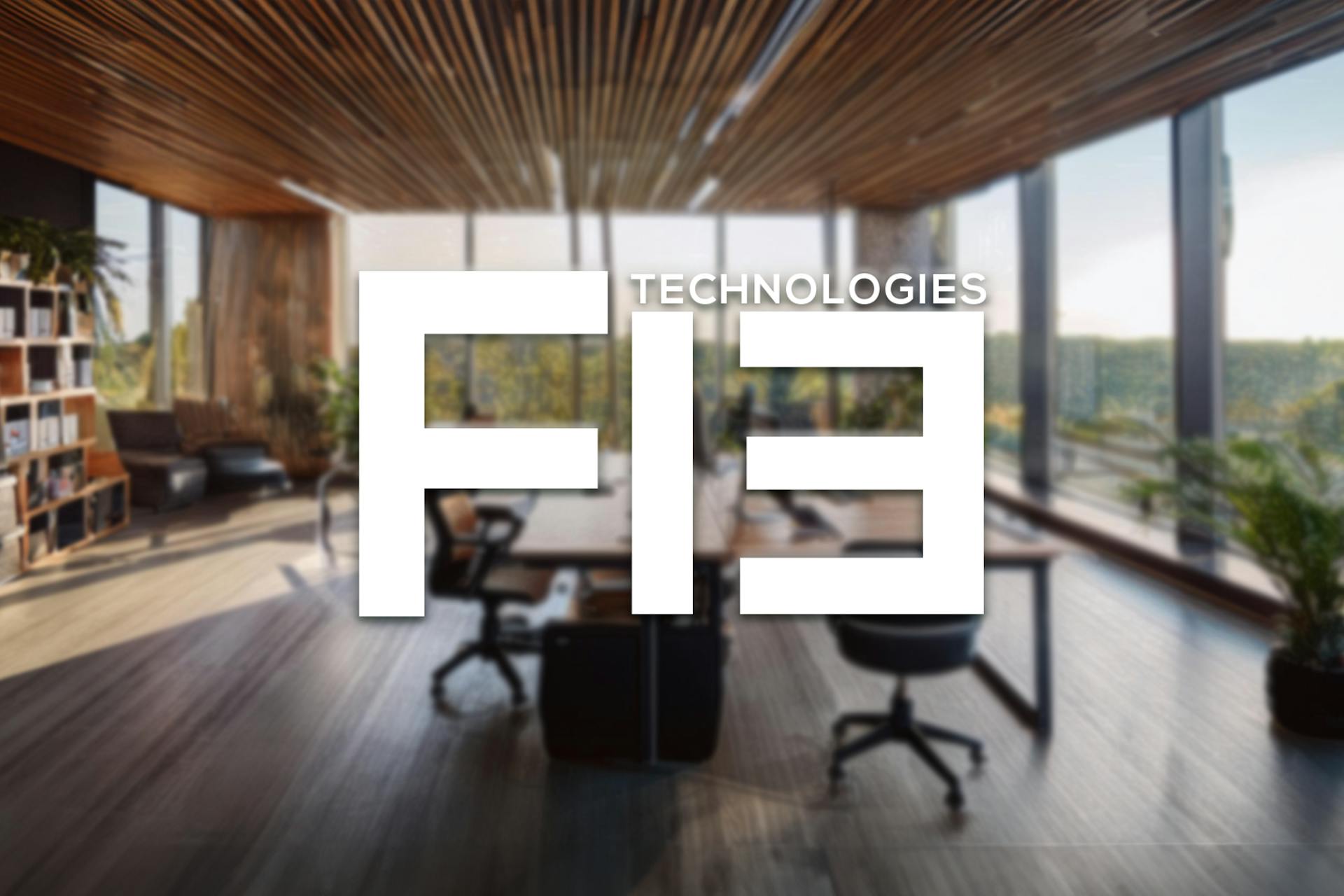 "F13" over the blurred image of a bright spacious office