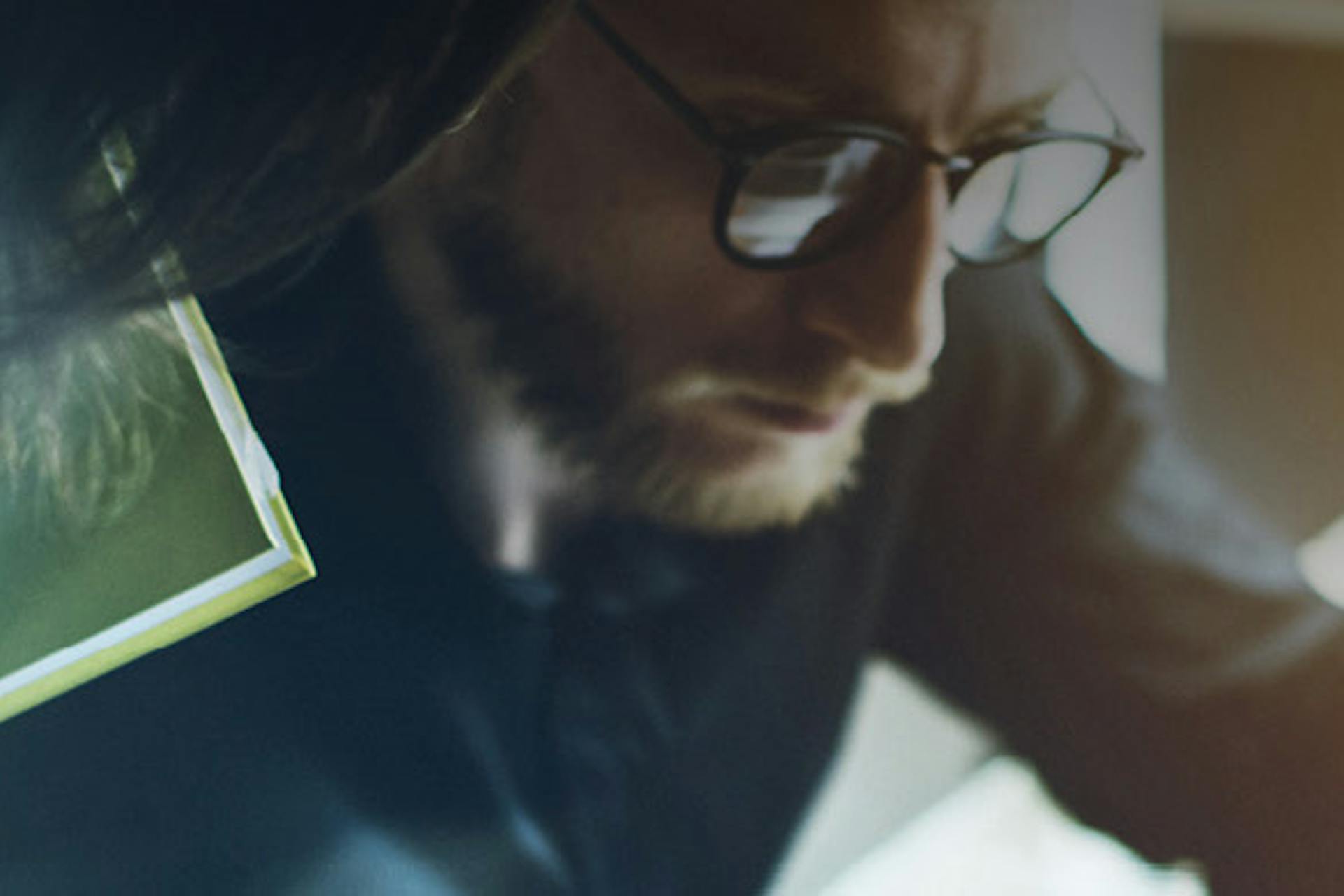 Photo of a man with glasses working