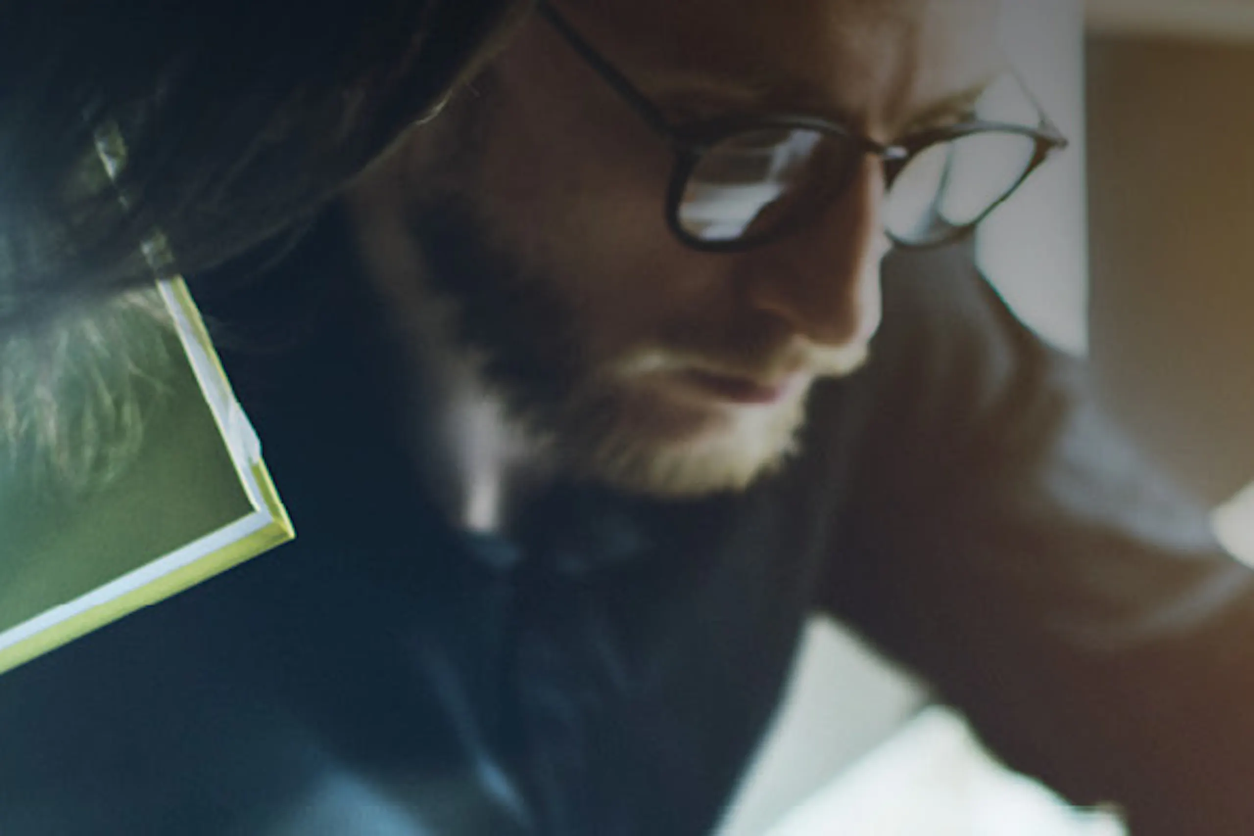 Photo of a man with glasses working