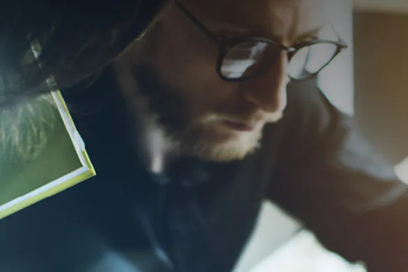 Photo of a man with glasses working