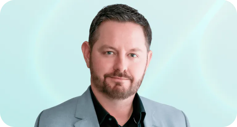 Headshot of Chris Hackney, CPO at Meltwater