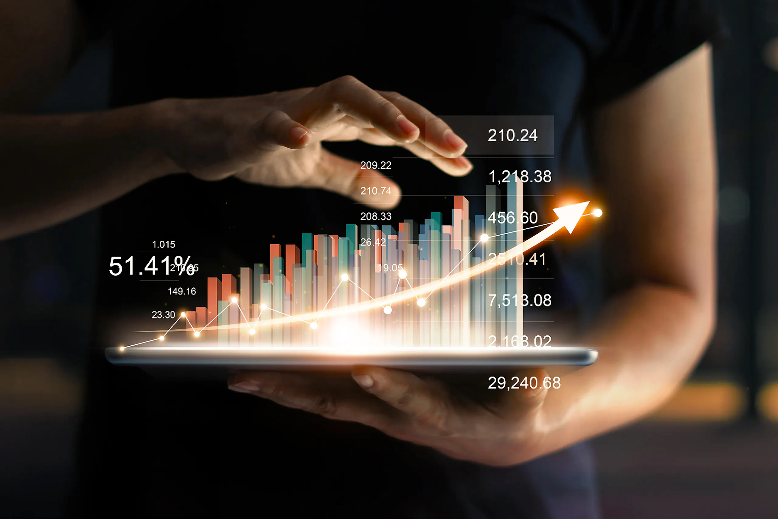 Image of someone showing analytics on their iPad with the diagrams coming out of the tablet in 3D