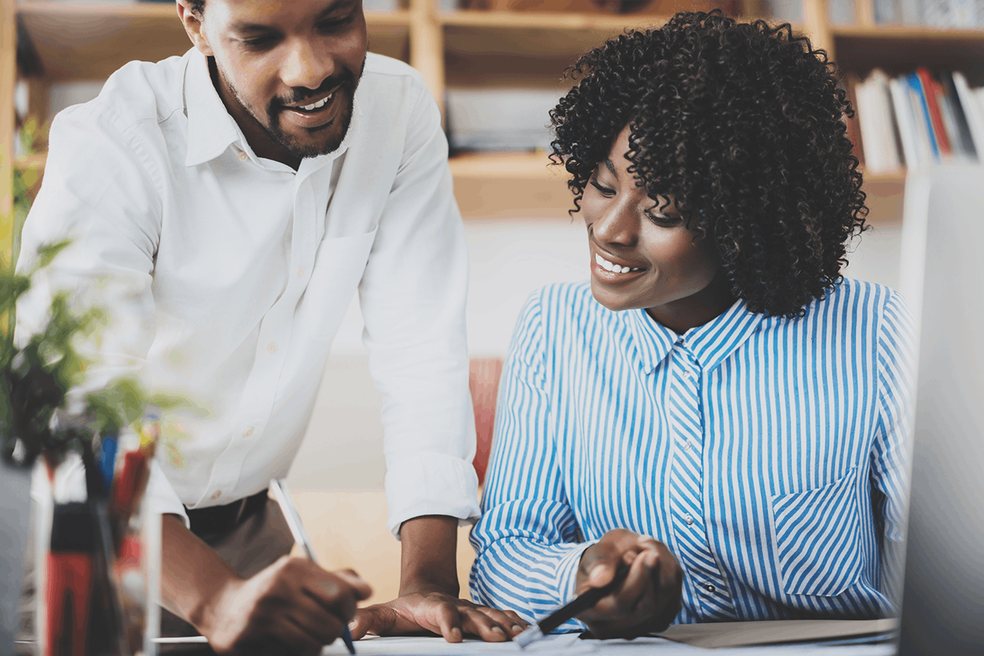 Photo of a man and a woman working together