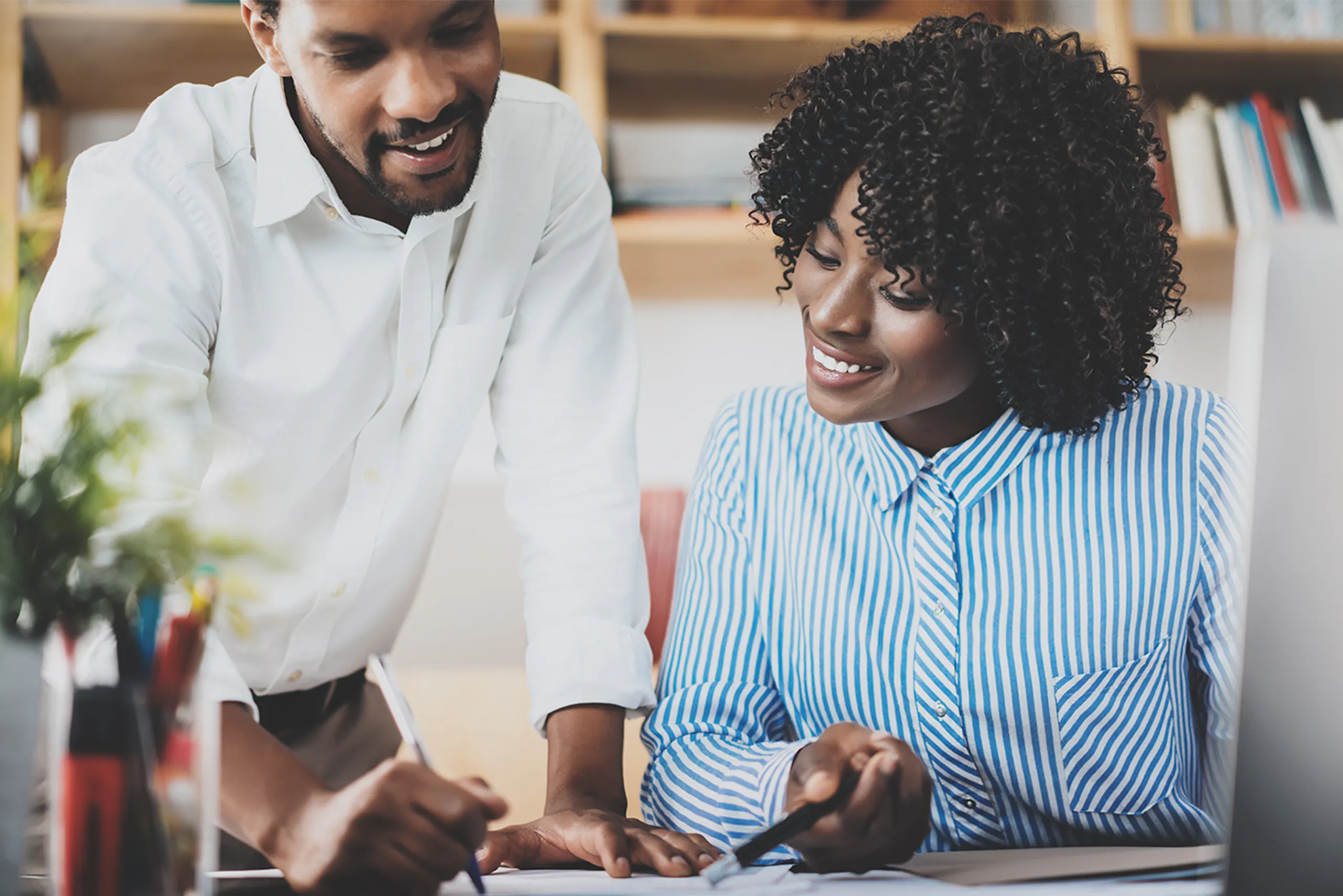 Photo of a man and a woman working together
