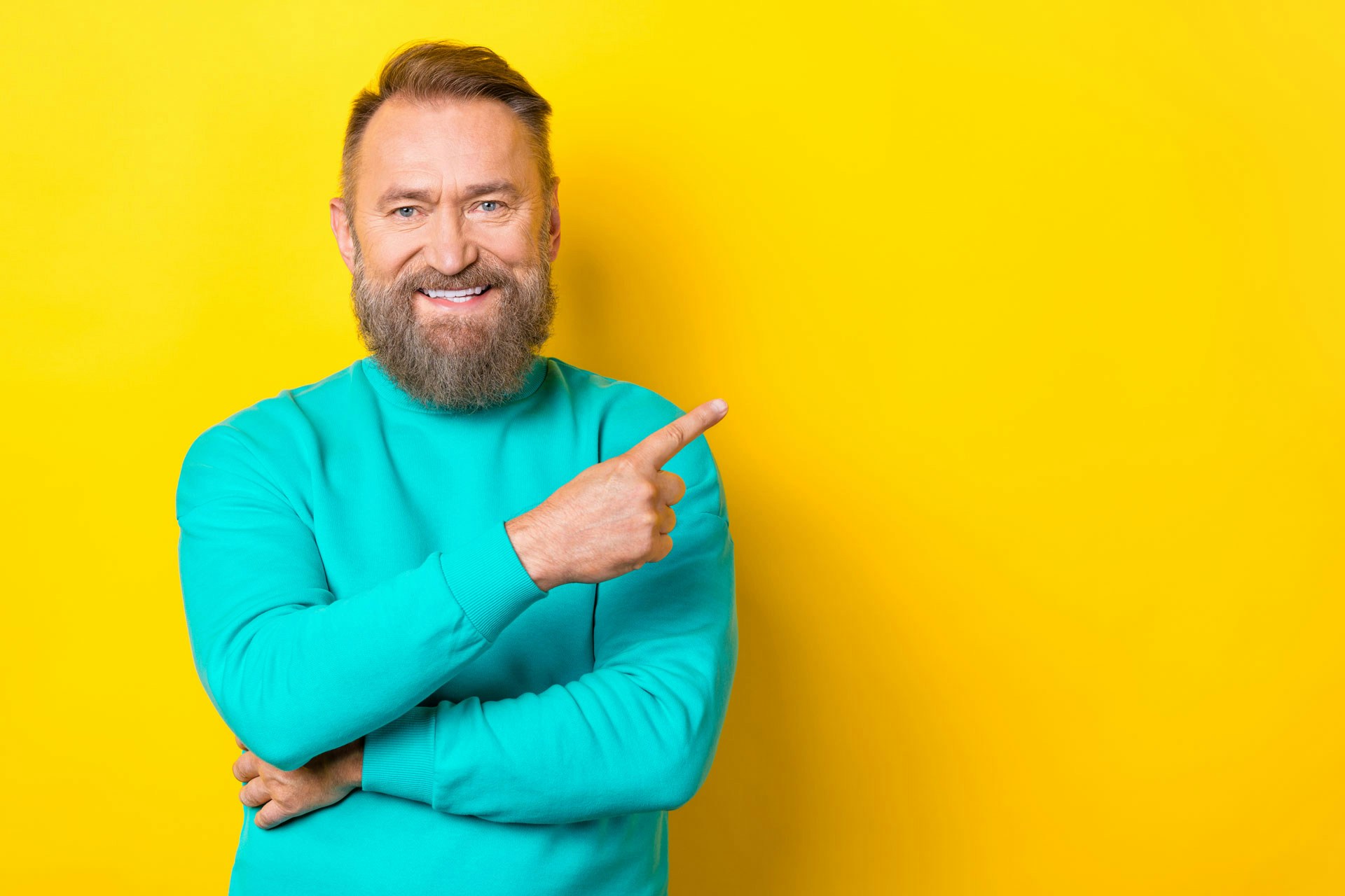A man standing in front of a yellow background
