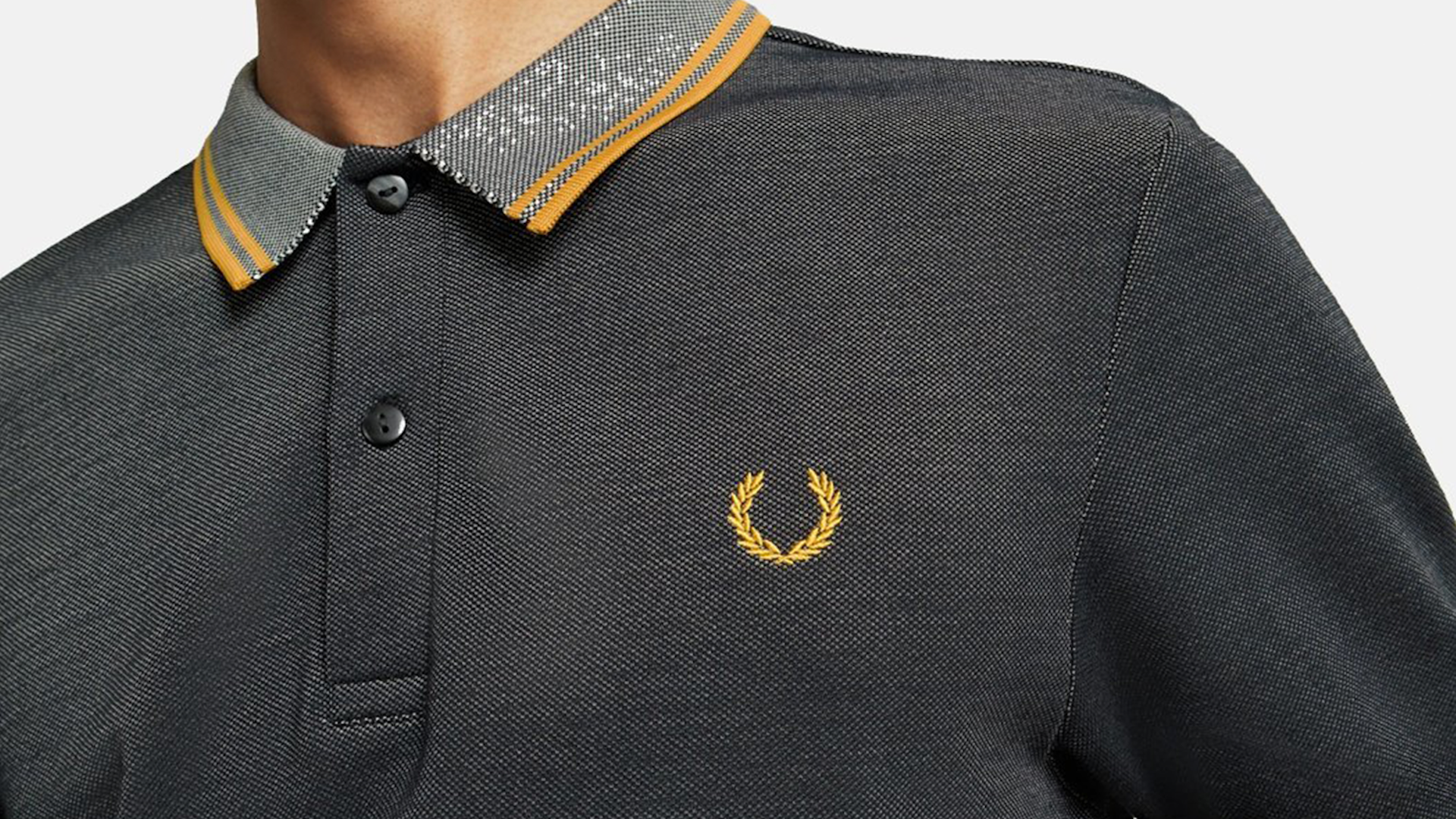 Photo of a grey-yellow Fred Perry tshirt