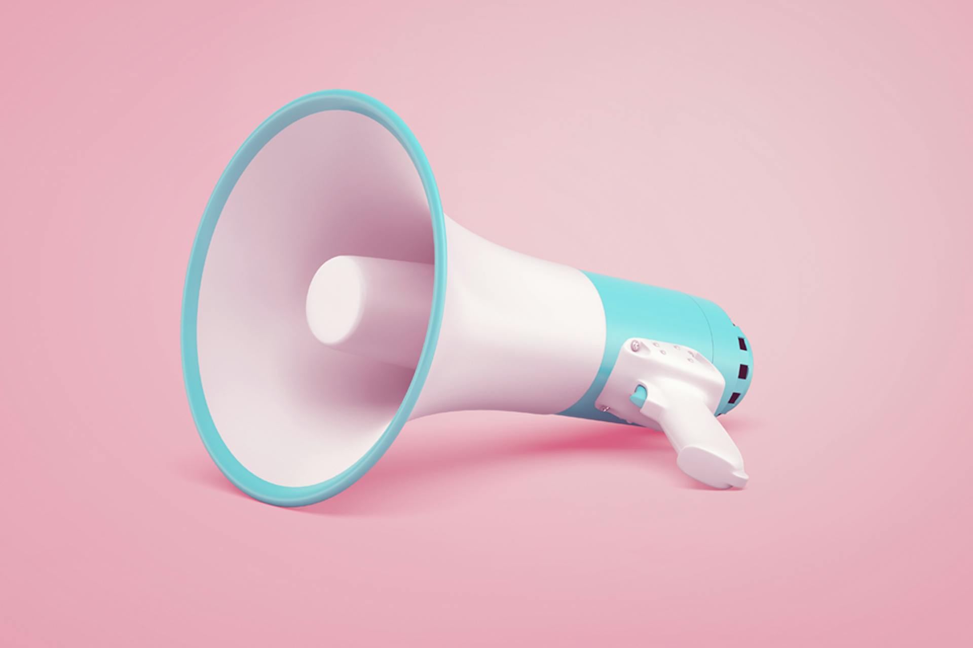 A 3D rendering of a megaphone laying on its side. A megaphone is used to disseminate a message to a large number of people and is often associated with public relations professionals, as they are trying to spread a message about their client's products or news to media outlets. That's why this image is being used as the header image for a blog on the 10 of the Best PR Campaigns of 2021
