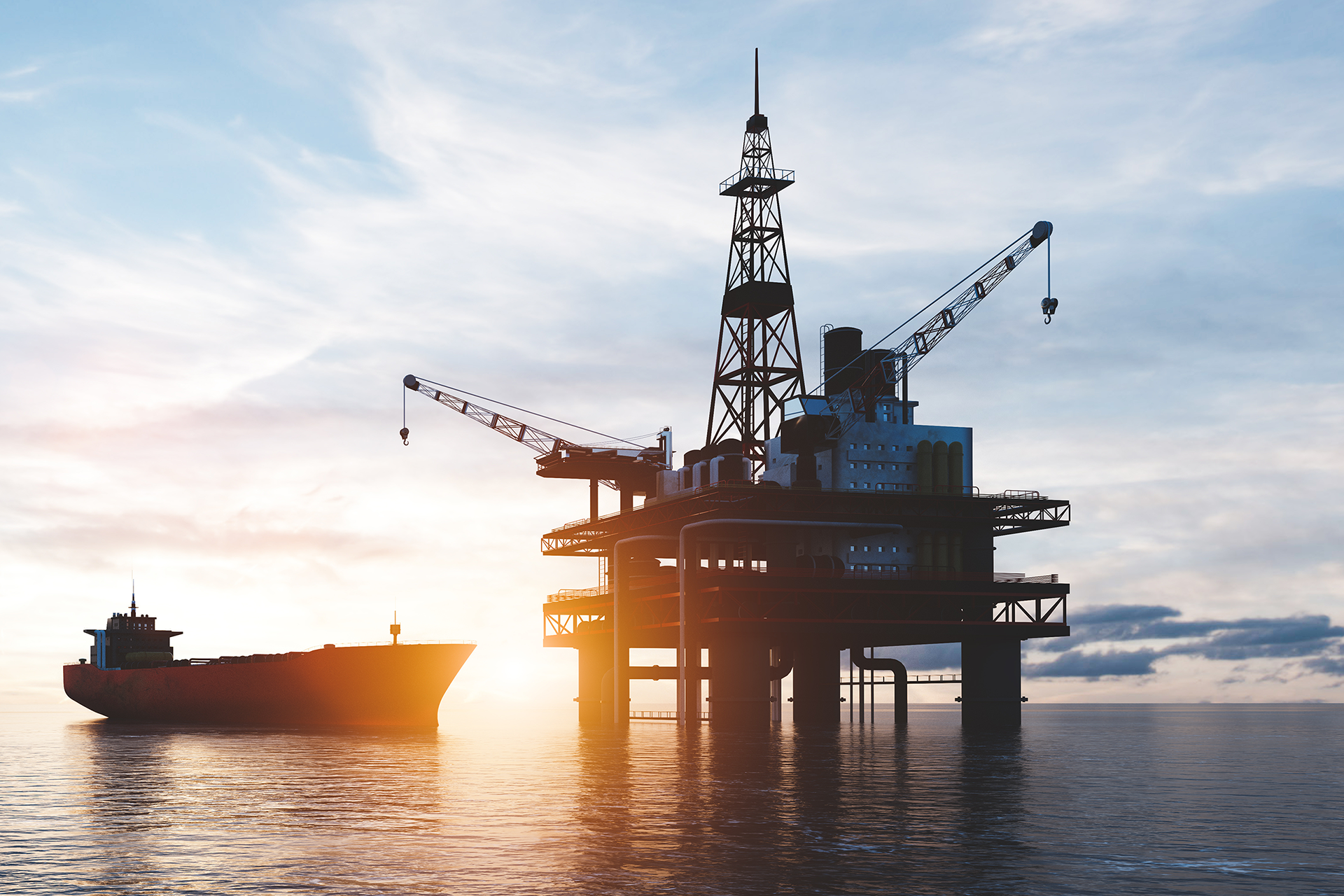 An oil rig and tanker at sea in this image for Meltwater's 2023 Industry Snapshot: Energy.