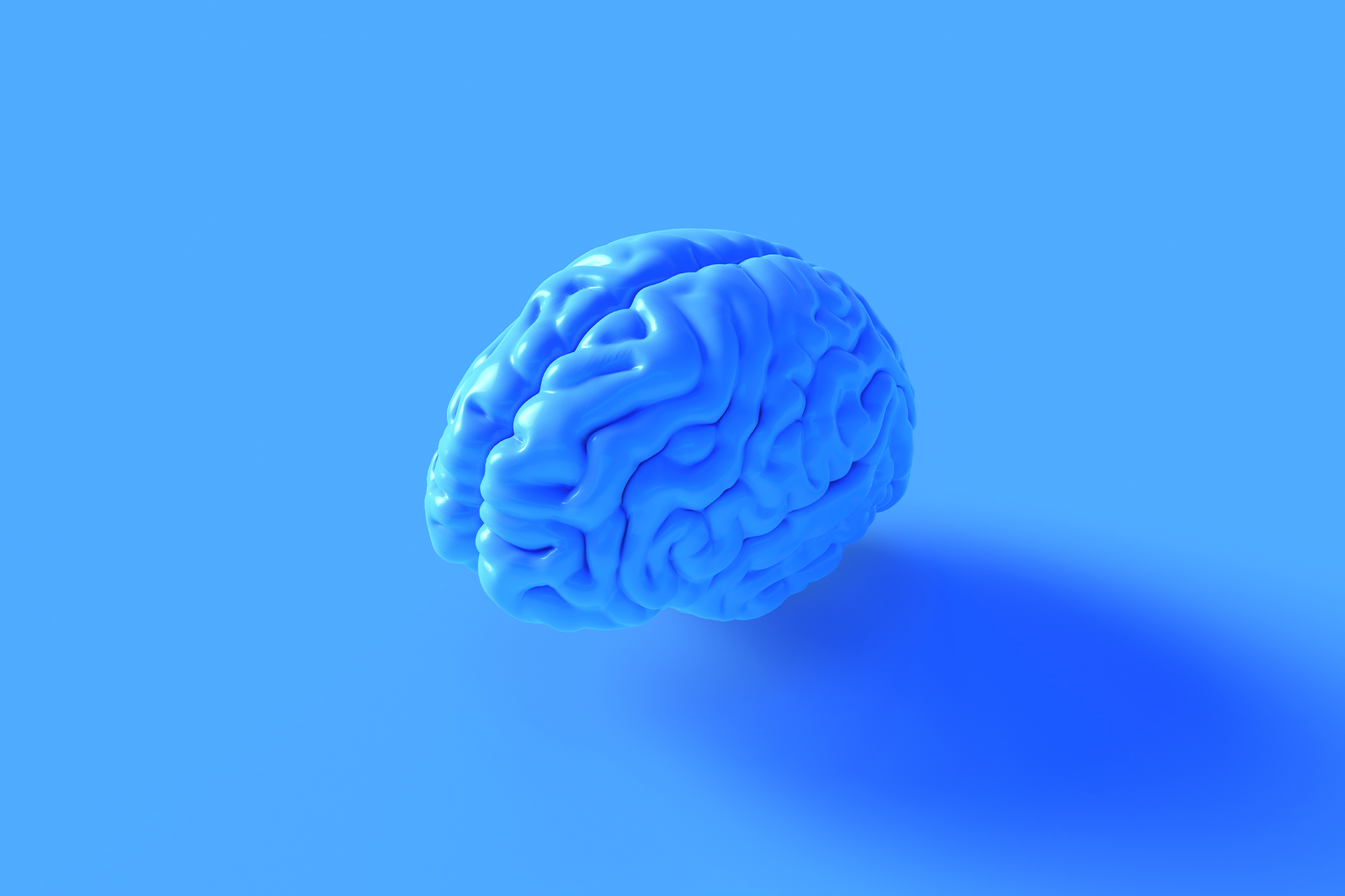 A model of the human brain that is blue set against a blue background. We think (get it) was the perfect choice for our blog on market intelligence.